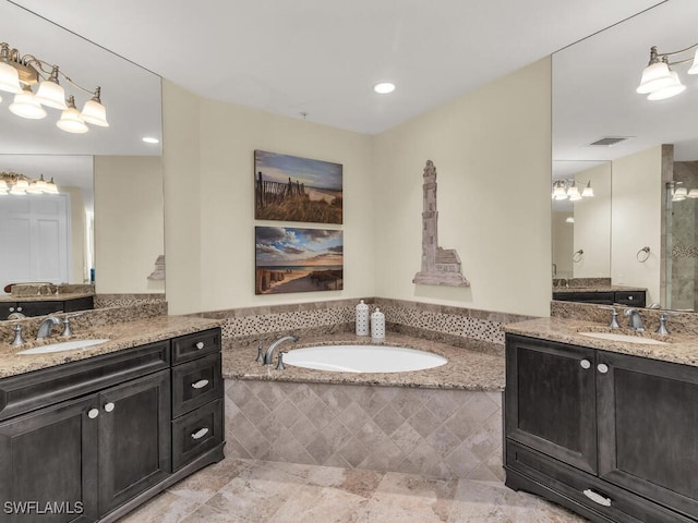 930 Cape Marco Dr Unit 806, Marco Island, FL 34145 - bathroom featuring vanity and tiled tub