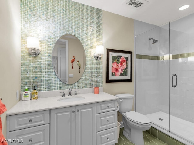 930 Cape Marco Dr Unit 806, Marco Island, FL 34145 - bathroom featuring vanity, tile patterned floors, a shower with door, and toilet