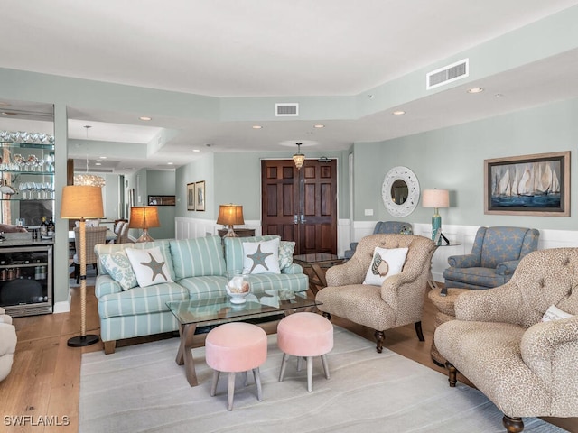 930 Cape Marco Dr Unit 806, Marco Island, FL 34145 - living room with a tray ceiling and light wood-type flooring