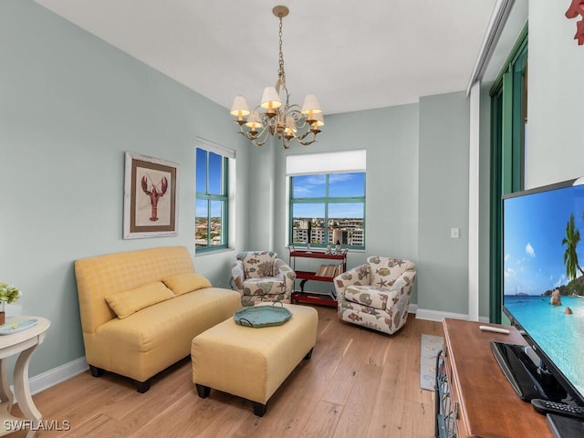 930 Cape Marco Dr Unit 806, Marco Island, FL 34145 - sitting room featuring a chandelier and light hardwood / wood-style flooring
