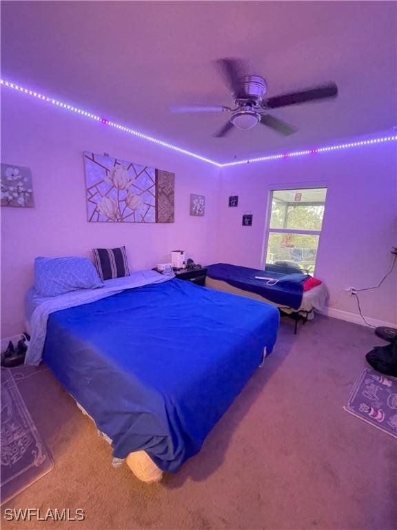 bedroom with ceiling fan and carpet