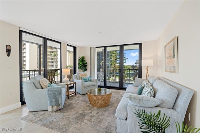 living room featuring a wall of windows and french doors