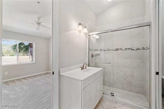 full bath featuring ceiling fan, lofted ceiling, vanity, baseboards, and a shower stall