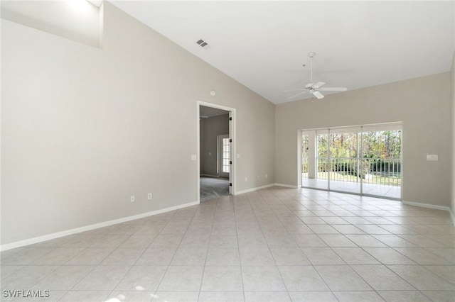 unfurnished room featuring light tile patterned floors, visible vents, a ceiling fan, and baseboards