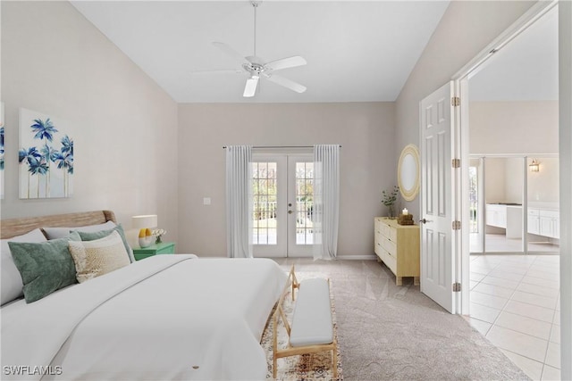 bedroom with french doors, light tile patterned floors, lofted ceiling, light carpet, and access to outside