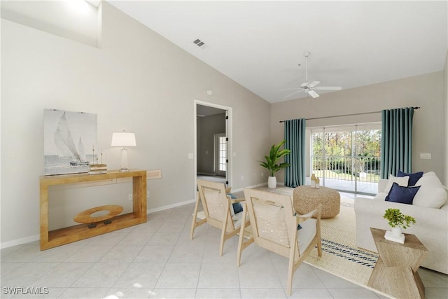 living room with ceiling fan, light tile patterned floors, visible vents, and baseboards