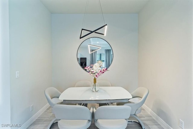 dining space with light wood-type flooring