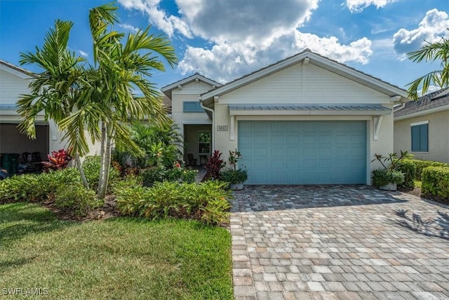 view of front facade with a garage and a front yard