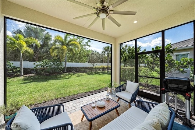 sunroom / solarium with ceiling fan