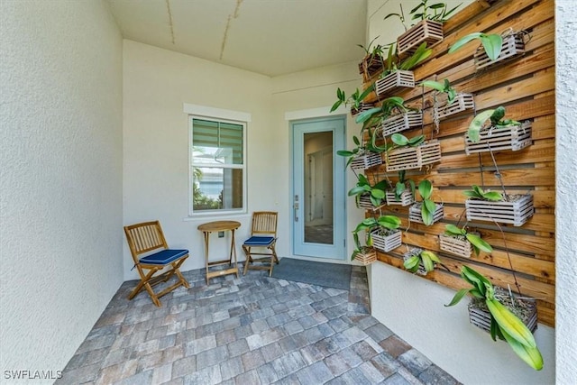 property entrance with a patio