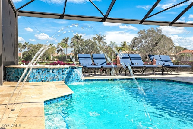 outdoor pool with a lanai and a patio