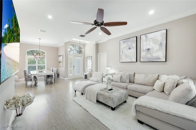 living area featuring ceiling fan with notable chandelier, baseboards, crown molding, and recessed lighting