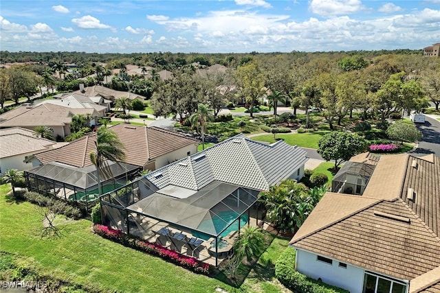 birds eye view of property with a residential view