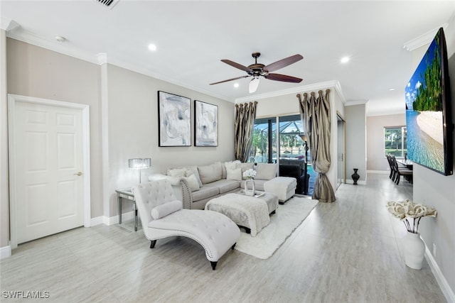 living room with baseboards, a ceiling fan, crown molding, and recessed lighting