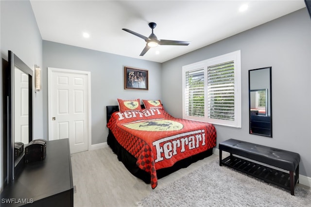 bedroom with a ceiling fan, recessed lighting, light wood finished floors, and baseboards