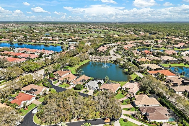 aerial view with a water view and a residential view