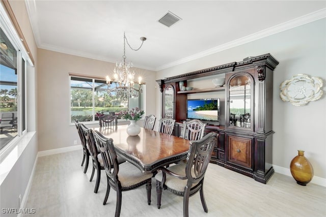 dining room featuring visible vents, baseboards, an inviting chandelier, and crown molding