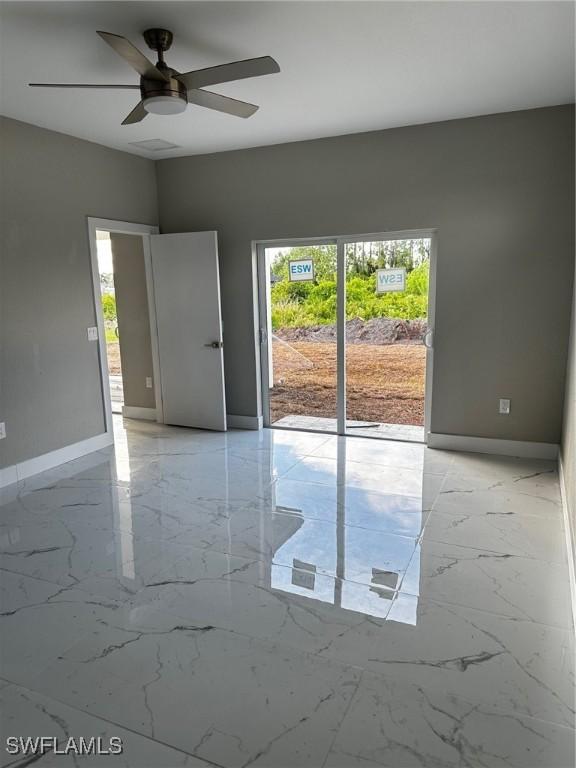 2507 30th St SW, Lehigh Acres, FL 33976 - empty room with ceiling fan