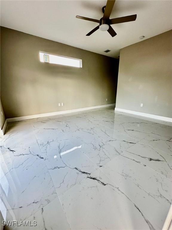 2507 30th St SW, Lehigh Acres, FL 33976 - empty room featuring ceiling fan