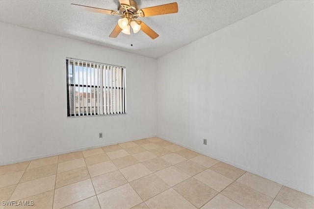 4345 27th Ct SW Unit 204, Naples, FL 34116 - spare room with a textured ceiling, ceiling fan, and light tile patterned flooring