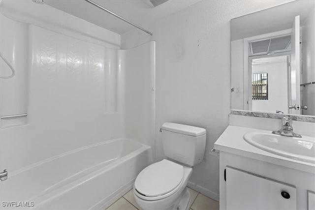4345 27th Ct SW Unit 204, Naples, FL 34116 - bathroom with toilet, tub / shower combination, tile patterned flooring, vanity, and baseboards