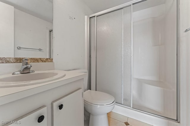 4345 27th Ct SW Unit 204, Naples, FL 34116 - full bathroom with a stall shower, tile patterned floors, toilet, and vanity