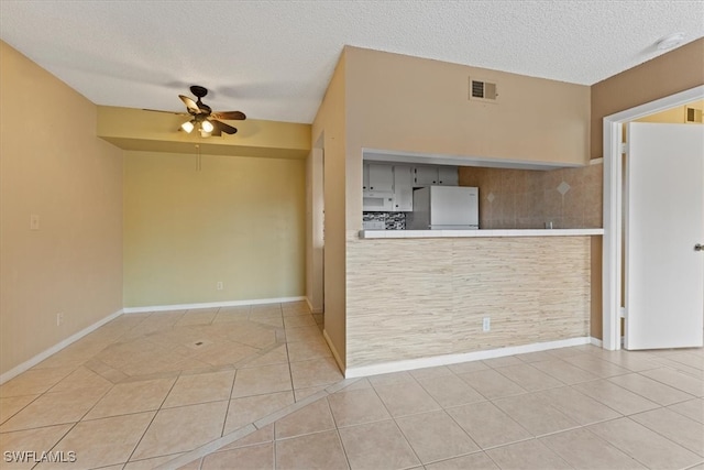 4345 27th Ct SW Unit 204, Naples, FL 34116 - unfurnished room with a ceiling fan, tile patterned flooring, a textured ceiling, and baseboards