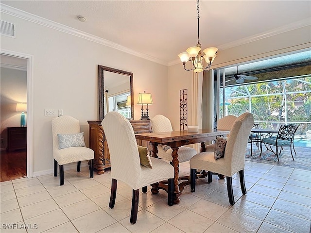 dining room with light tile patterned floors, plenty of natural light, visible vents, and crown molding