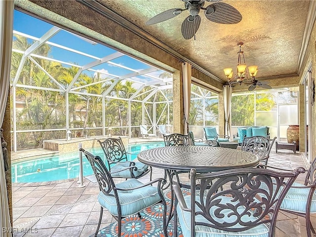 exterior space with an outdoor pool, glass enclosure, and ceiling fan