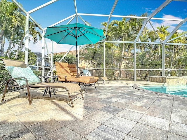 view of patio / terrace with a lanai and an outdoor pool