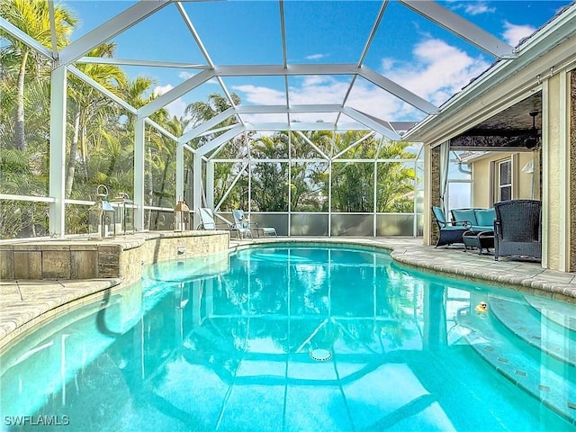 pool featuring a lanai and a patio area