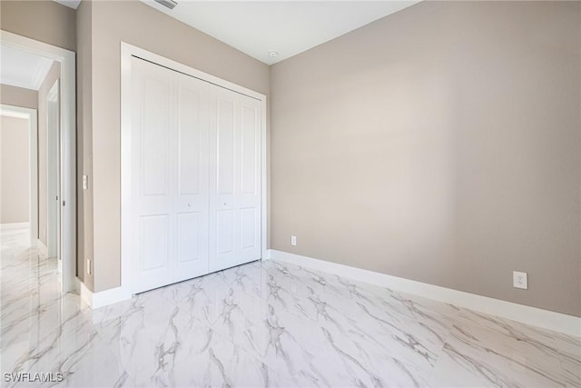 unfurnished bedroom with a closet