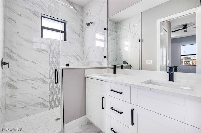 bathroom featuring vanity, a wealth of natural light, and walk in shower