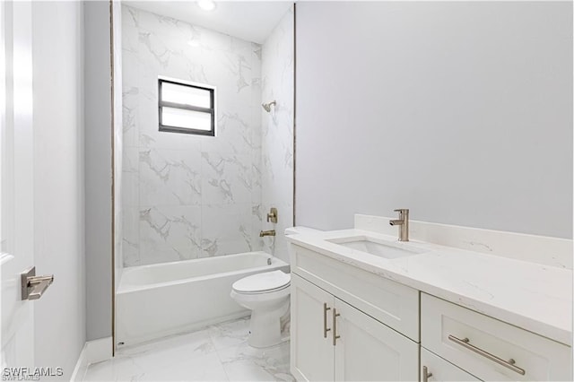 full bathroom with tiled shower / bath, vanity, and toilet