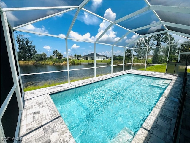 view of swimming pool featuring a water view and glass enclosure