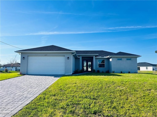 view of front of home featuring a front lawn, decorative driveway, an attached garage, and stucco siding