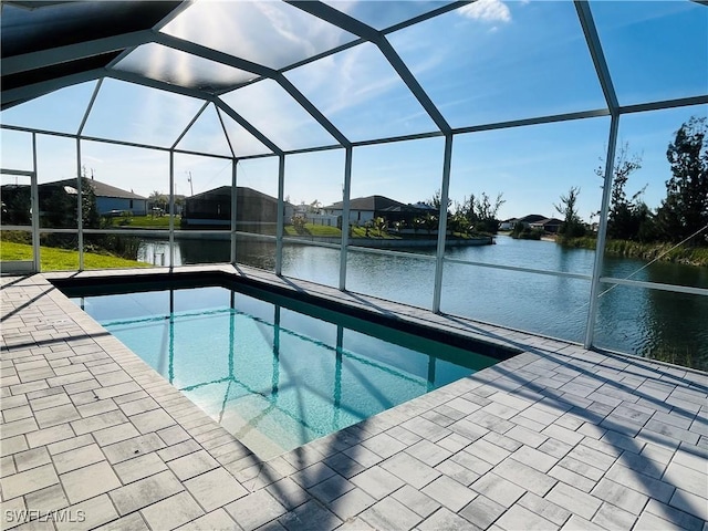 view of swimming pool featuring a lanai, a water view, and a patio