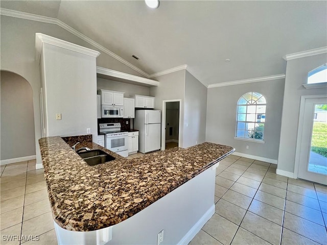 kitchen featuring sink, white cabinetry, ornamental molding, kitchen peninsula, and white appliances