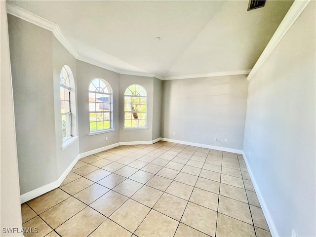 unfurnished room with crown molding and light tile patterned floors