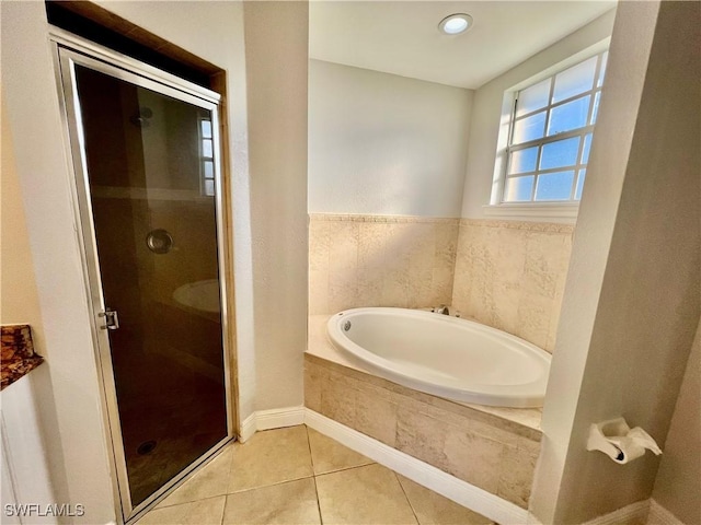 bathroom with tile patterned floors and separate shower and tub