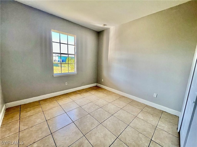 empty room featuring light tile patterned flooring