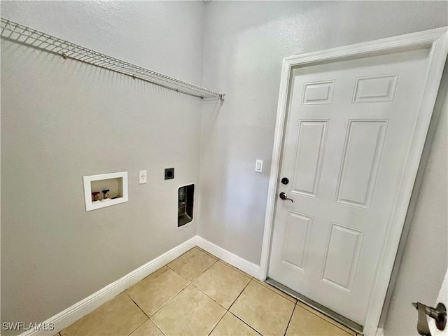 laundry area featuring hookup for a washing machine, light tile patterned flooring, and hookup for an electric dryer