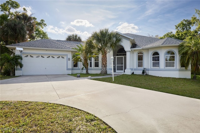 ranch-style home featuring roof with shingles, stucco siding, concrete driveway, an attached garage, and a front yard