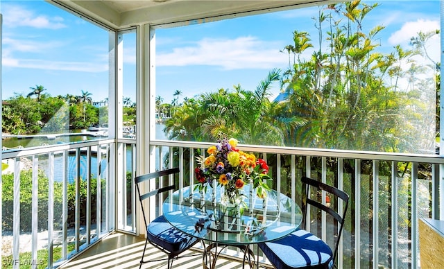 balcony featuring a water view