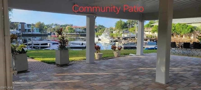 view of patio featuring a water view