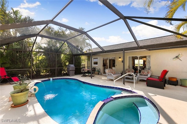 view of pool featuring pool water feature, an outdoor hangout area, a patio, and a lanai