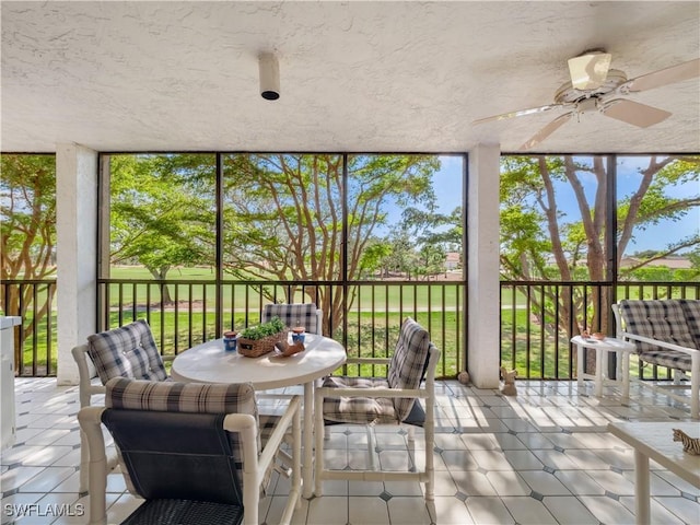 sunroom / solarium with ceiling fan and a wealth of natural light