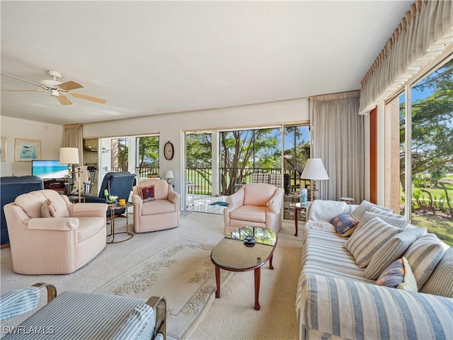 living room with ceiling fan and light carpet