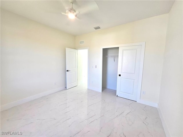 unfurnished bedroom featuring ceiling fan and a closet