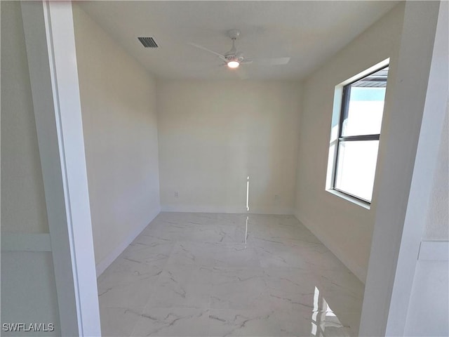 empty room featuring ceiling fan